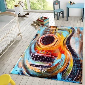 May include: A colorful abstract rug with a large, painted guitar design. The guitar is painted in shades of orange, yellow, blue, and green. The rug has a distressed, vintage look.