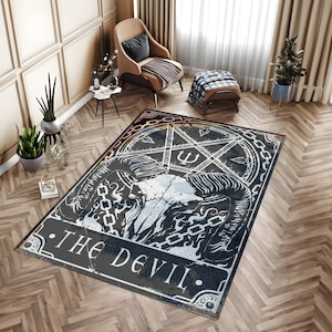 May include: A black and white rug with a pentagram and a skull with horns. The text "THE DEVIL." is written on the rug.