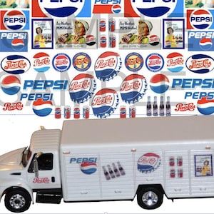 May include: A white delivery truck with Pepsi-Cola branding. The truck has a variety of Pepsi-Cola logos and images on the sides, including a red and blue Pepsi logo, a red and white Pepsi-Cola logo, and a can of Pepsi-Cola. The truck also has a red and white Pepsi-Cola logo on the back.