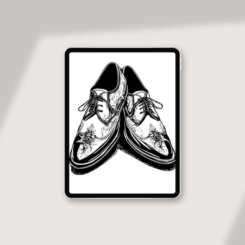 May include: A pair of black leather shoes with intricate floral designs. The shoes have lace-up closures and a pointed toe.