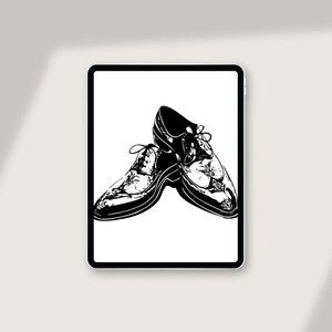 May include: A pair of black leather dress shoes with intricate detailing. The shoes are angled and positioned to show the design of the leather.