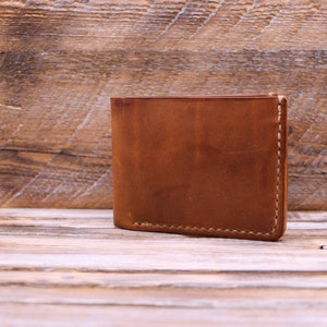 Cartera de cuero plegable tradicionalista hecha a mano