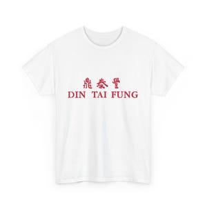 May include: White t-shirt with red text that reads "Din Tai Fung" and Chinese characters.