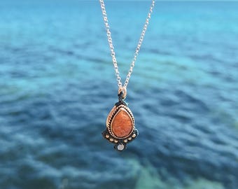 Sun Stone Pendant in sterling silver and macramé.