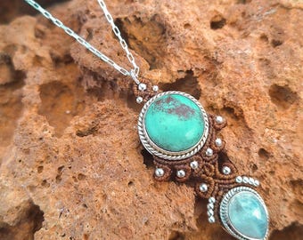 Silver pendant with Tibetan Turquoise and Moonstone, woven in a toasted caramel color. Surya, a unique jewel from the Eclipse Collection.