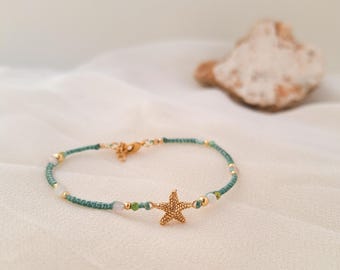 Gold-plated starfish bracelet with natural stones. Thin macramé bracelet with a sea charm. Jewelry with a golden starfish.