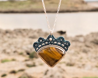 Silver pendant with a triangular Tiger's Eye stone. Unique macrame jewelry