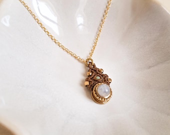 Necklace with round moonstone. Gold-plated brass pendant with small white stone. Minimalist handmade jewelry.