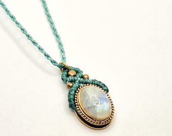 Macrame pendant with moonstone and brass details. Handmade jewelry.