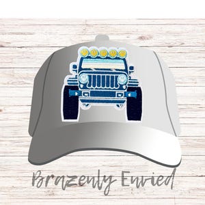 May include: A gray baseball cap with a blue and white embroidered Jeep design. The Jeep has yellow lights on the roof.