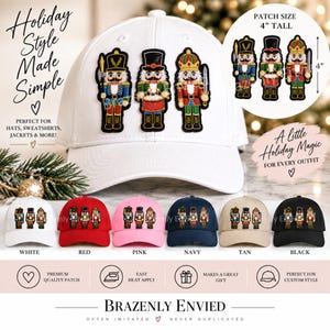 May include: A white baseball cap featuring three embroidered nutcracker patches. The patches are 4 inches tall. Below, six baseball caps in white, red, pink, navy, tan, and black are displayed, each adorned with the same three nutcracker designs.