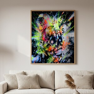 May include: A framed art print featuring a vibrant, graffiti-style skull. The artwork uses a bold color palette of neon green, orange, pink, and blue against a black background. The skull has large, dark eye sockets and a detailed jawline, with a crown above it.