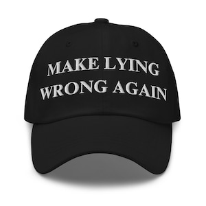 May include: Black baseball cap with white embroidered text that reads "Make Lying Wrong Again".