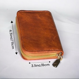 Cartera pequeña con cremallera alrededor del tarjetero, diseño compacto y duradero para mujeres con múltiples compartimentos para tarjetas y efectivo.