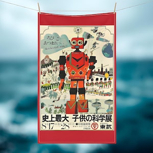 May include: A red and orange vintage-style poster featuring a large robot with a retro design. The poster has Japanese text and illustrations of people, animals, and buildings. The poster is hanging on a clothesline.