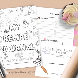 May include: A recipe journal with the text "My Recipe Journal" and illustrated cooking-themed doodles. Includes a recipe page, a "Junior Chef Award" certificate, a cupcake, a rolling pin, and a whisk. The journal is designed for recording recipes.