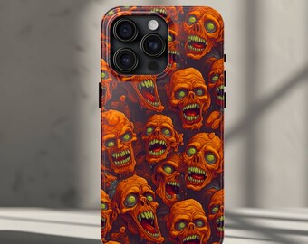 May include: A black phone case with a pattern of orange and red zombie faces. The case has a camera lens cutout and a black border.