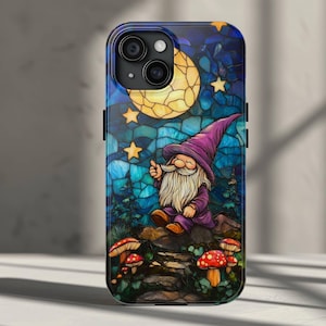 May include: A stained glass phone case featuring a gnome with a purple hat and a white beard, reaching for a star in a night sky with a crescent moon. The background is a blue and green stained glass design with red mushrooms.