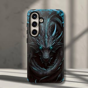 May include: Black phone case featuring a detailed illustration of a dragon. The dragon is depicted in shades of black and teal, with glowing teal eyes. The case has a glossy finish and a camera cutout.