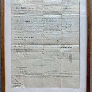 May include: A framed antique document, dated 1826, with handwritten text. The paper is yellowed with age and framed in a wooden frame. The text includes the words "Indenture" and "Covenant".