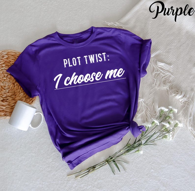 May include: Purple t-shirt with the text "PLOT TWIST: I choose me" in white.