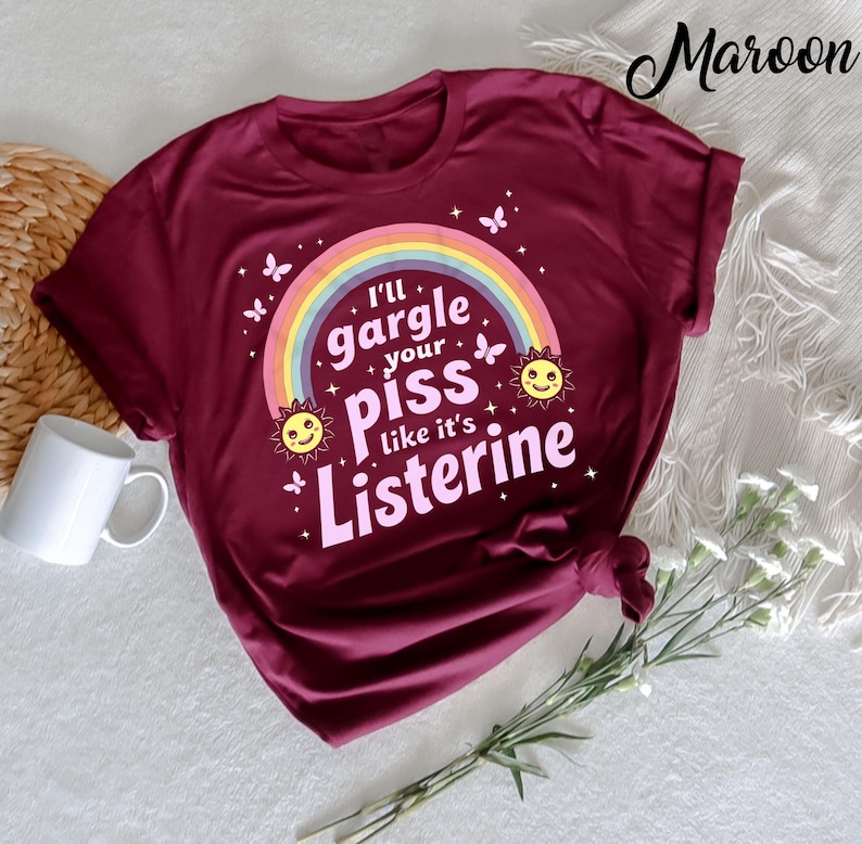 Make a bold statement with the "I'll Gargle Your Piss Like It's Listerine" Funny Adult Humor T-shirt. Featuring a provocative and edgy quote, this shirt is perfect for fans of dark humor and adult jokes. Made from soft cotton,