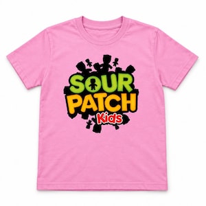 May include: A light pink short-sleeve t-shirt featuring a central graphic with the text SOUR PATCH Kids in lime green, yellow, and red. The logo is surrounded by black silhouettes of small candy figures against a white background.