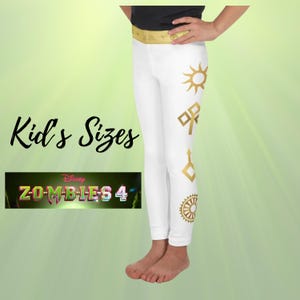 May include: White leggings with gold geometric designs. The leggings have a gold waistband and are labeled "Kid's Sizes". The image also features the "Disney Z-O-M-B-I-E-S 4" logo.