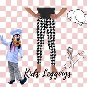 May include: Black and white houndstooth leggings for children. The leggings are shown on a child model. The image also includes a cartoon chef dog wearing a chef hat and a cartoon chef hat and rolling pin.