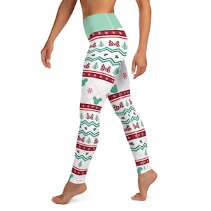 May include: White leggings with a festive Christmas pattern featuring red, green, and white snowflakes, bows, and Mickey Mouse heads.