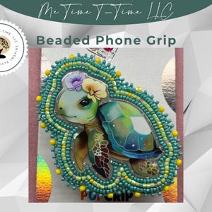 May include: A beaded phone grip with a sea turtle design. The turtle has a green and blue shell, decorated with flowers. The grip is edged with turquoise and yellow beads. The text "Beaded Phone Grip" is visible.