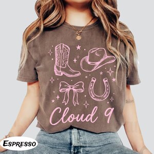 May include: A handmade wooden sign with the text "Welcome" in a playful font. The sign features a distressed white background and a dark brown frame, perfect for a front door or entryway. The sign measures approximately 12 inches wide and 6 inches tall.