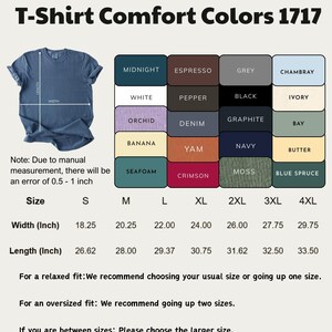 May include: A denim blue t-shirt with a size chart and color swatches. The chart lists sizes S to 4XL, with width measurements from 18.25 to 29.75 inches and lengths from 26.62 to 33.50 inches. Color options include Midnight, White, and Crimson.