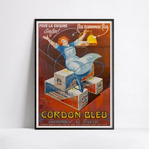 May include: Vintage French poster advertising Cordon Bleu butter. The artwork shows a woman in a blue dress and red hair, with boxes of butter. Text includes "Pour la Cuisine Enfin!" and "Economise le beurre."