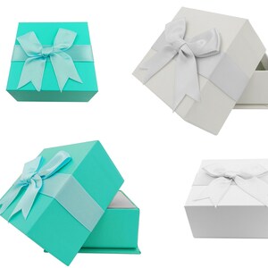 Puede incluir: Se muestran cuatro cajas de regalo. Dos son turquesas con cinta y lazo a juego, y dos son blancas con cinta y lazo plateados. Una caja turquesa est&aacute; abierta, revelando un interior blanco.