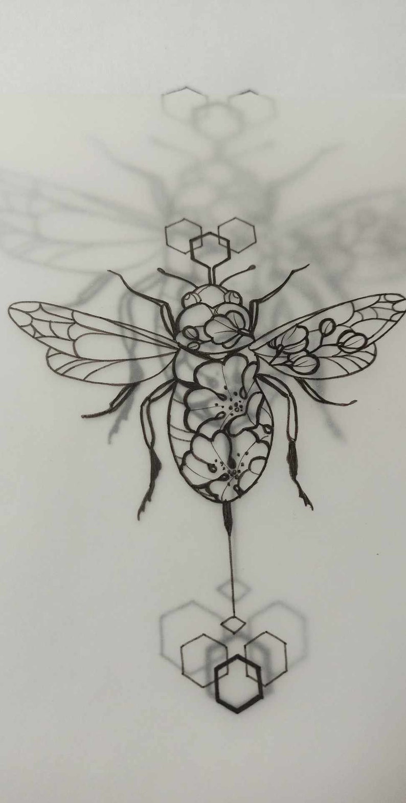 May include: A black and white line drawing of a bee with floral details. The bee is surrounded by geometric shapes, resembling honeycombs.