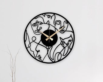 Reloj de pared de metal de arte moderno: caras abstractas, decoración silenciosa