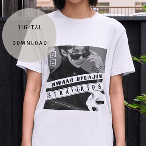 May include: White t-shirt featuring a black and white graphic print of a person wearing sunglasses and the text "HWANG HYUNJIN STRAY KIDS everywhere all around the world".