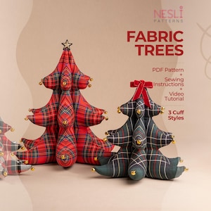 May include: Three stuffed fabric Christmas trees with plaid patterns. One is red plaid with a star topper, one is dark green plaid with a red bow, and one is a smaller grey plaid. Each tree features small gold bells at the branch tips. Text reads NESLI PATTERNS FABRIC TREES.
