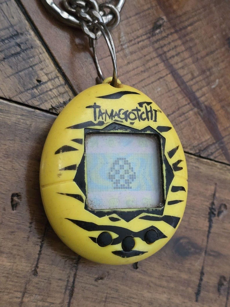 Virtual Pet , Original TAMAGOTCHI YELLOW TIGER ~ 1997 90's pop culture, powers on image 4