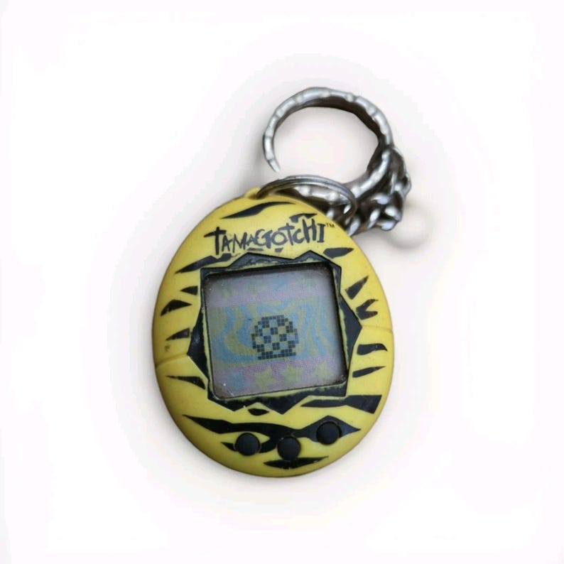 Virtual Pet , Original TAMAGOTCHI YELLOW TIGER ~ 1997 90's pop culture, powers on image 2