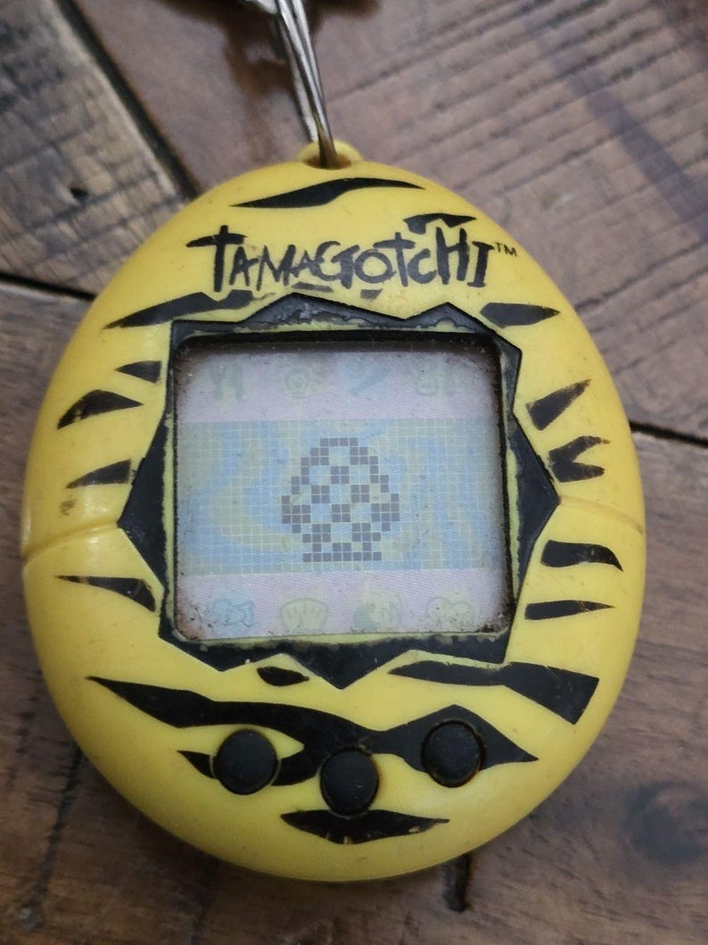 Virtual Pet , Original TAMAGOTCHI YELLOW TIGER ~ 1997 90's pop culture, powers on image 1