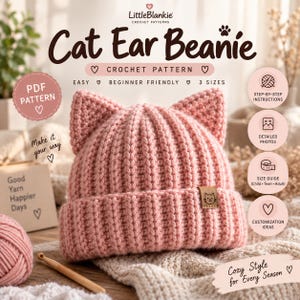 May include: A light pink crocheted beanie with cat ears and a folded brim. A small brown leather tag with a cat face icon is attached to the brim. The text reads LittleBlankie Cat Ear Beanie Crochet Pattern, Easy, Beginner Friendly, 3 Sizes.