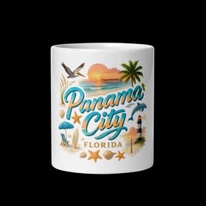 May include: White ceramic mug featuring a beach scene with the words "Panama City Florida" in a stylized font. The design includes a sunset, palm tree, pelican, dolphin, lighthouse, and seashells. A perfect gift for beach lovers.