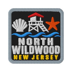 May include: A square embroidered patch with a black background and a grey border. It features a white seashell, a red lifeguard tower, and an orange starfish above blue waves. The text reads NORTH WILDWOOD in white and NEW JERSEY in yellow.