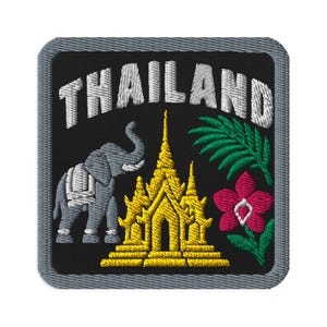 May include: A square embroidered patch with a black background and a gray border. It features the white text THAILAND arched at the top, a gray elephant, a golden temple structure, a green palm leaf, and a pink orchid flower with green leaves.