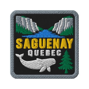 May include: A square embroidered patch with a black background featuring a white beluga whale, a green pine tree, and a blue river flowing between grey cliffs. The text SAGUENAY is stitched in yellow, and QUEBEC is stitched in white below it.