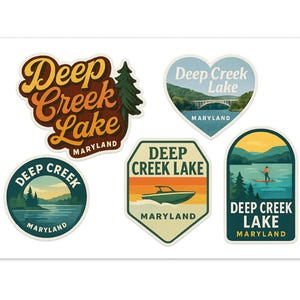 May include: A collection of Deep Creek Lake, Maryland stickers in various shapes. Designs include a heart, circle, and a shield, each with scenic lake views, boats, and the text "Deep Creek Lake" and "Maryland".