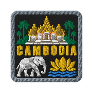 May include: A square embroidered patch with a grey border on a black background. It features a gold and white temple, green palm trees, the yellow text CAMBODIA, a white elephant, and a yellow lotus flower above blue water waves.
