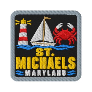 May include: A square embroidered patch with a black background and a grey border. It features a red and white lighthouse, a white sailboat, and a red crab above blue waves. The text reads ST. MICHAELS in yellow and MARYLAND in white letters.